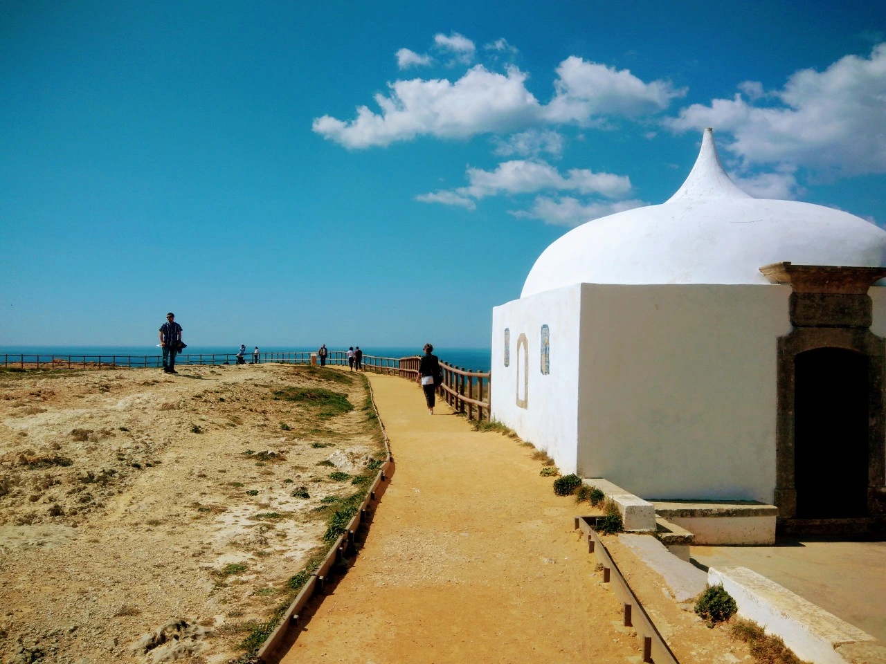 a white building with a dome on the side of it